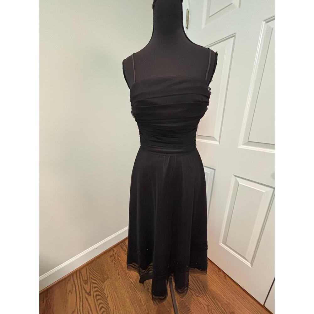 Eliza J. Black Sleeveless Cocktail Dress with Fitted Bodice and Beaded Hemline